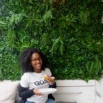 Black girl with donut at Blanche Bakery