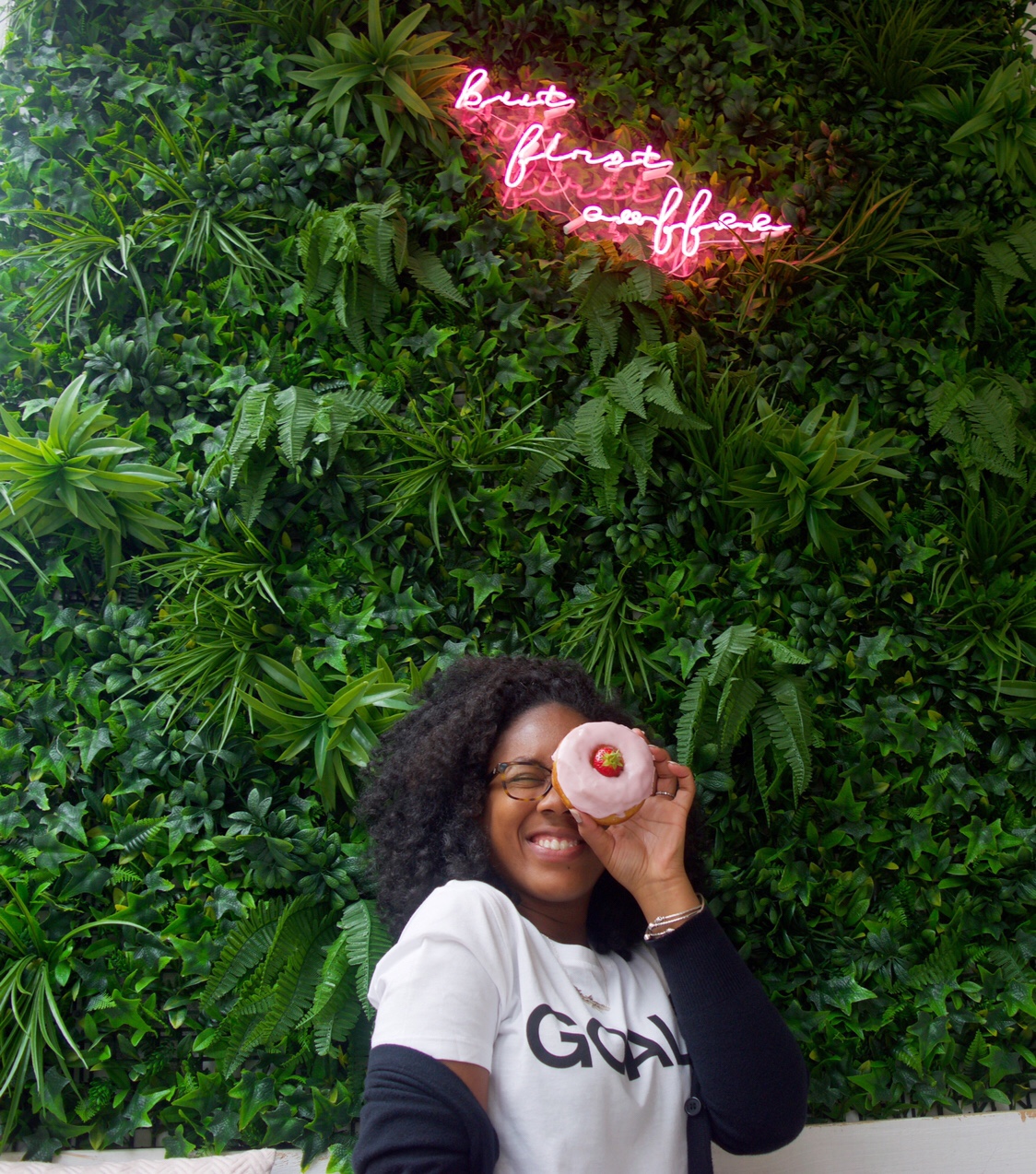 Black girl with donut at Blanche Bakery