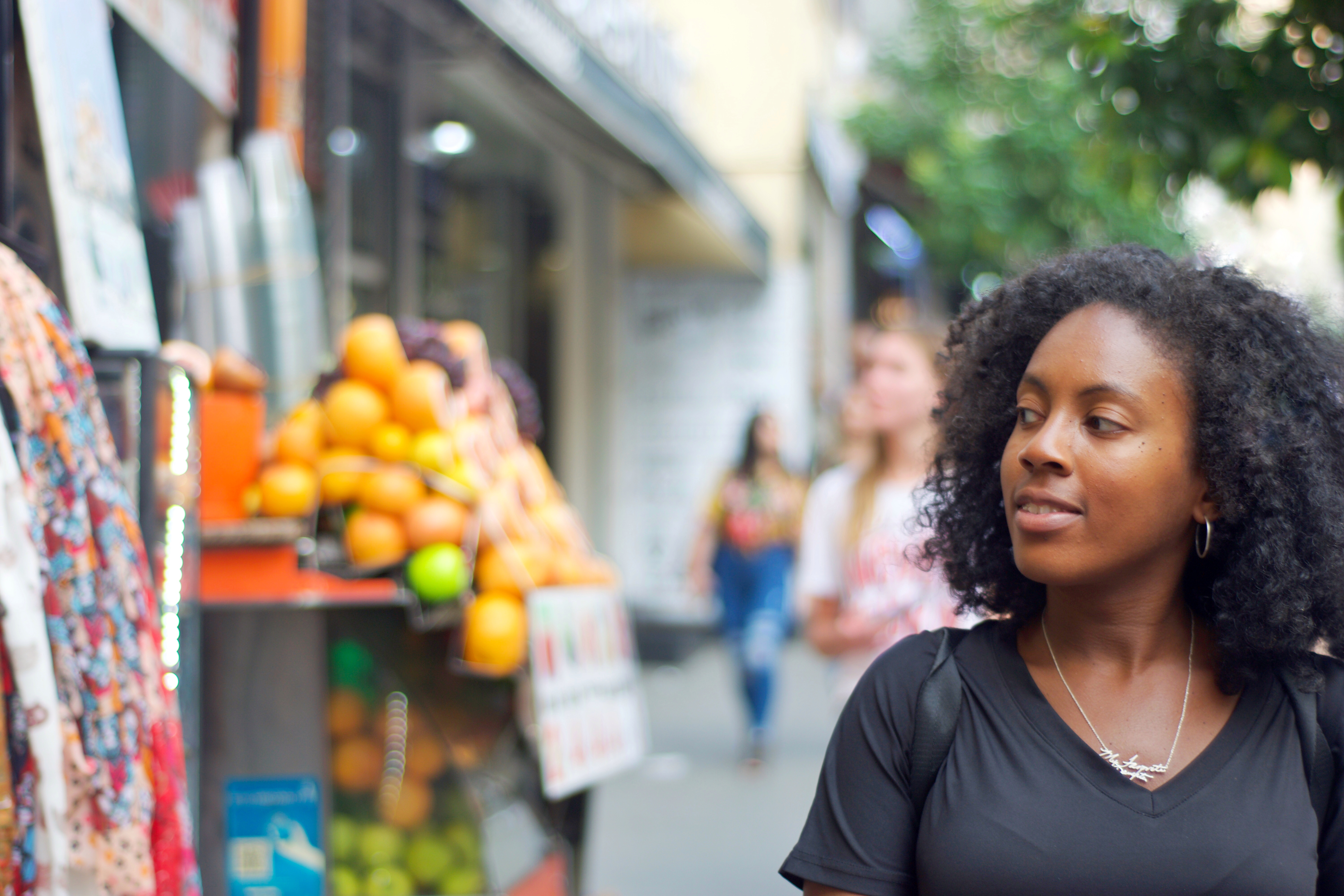 Black girl looking at fruit