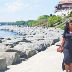 black girl walking along the beach