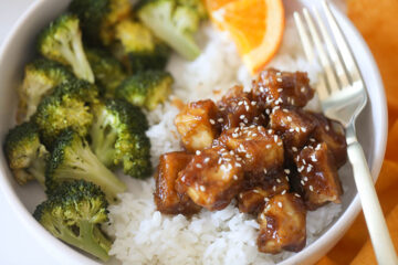 Orange Tofu in bowl with broccoli and white rice