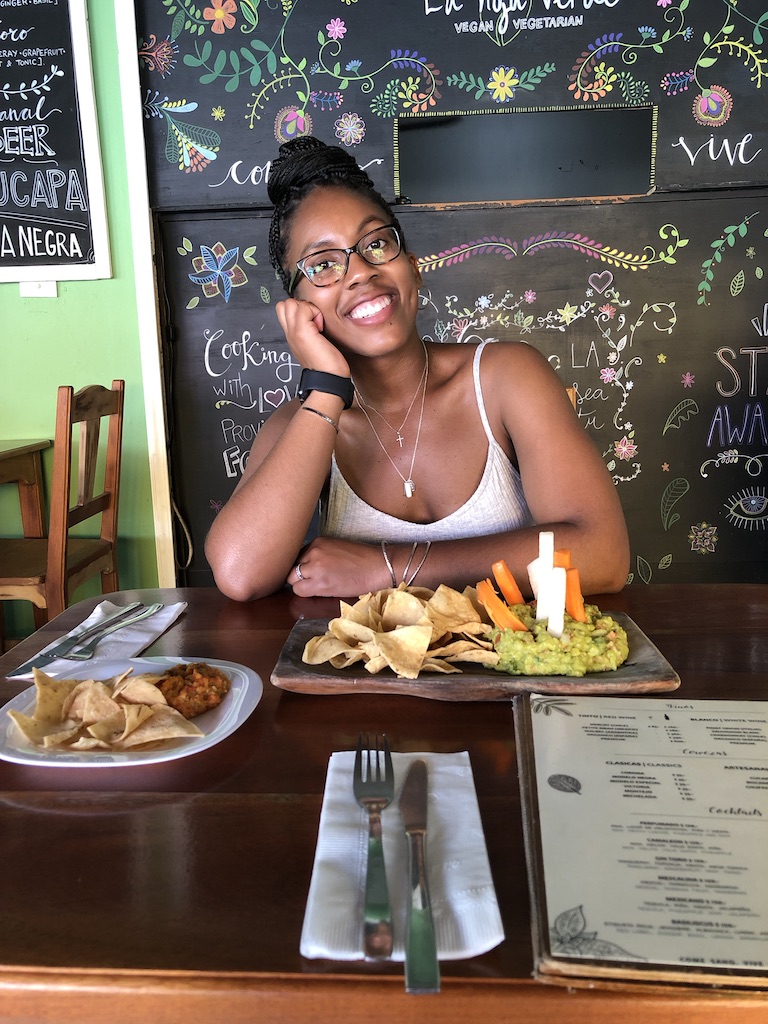 black girl at table at La Hoja Verde