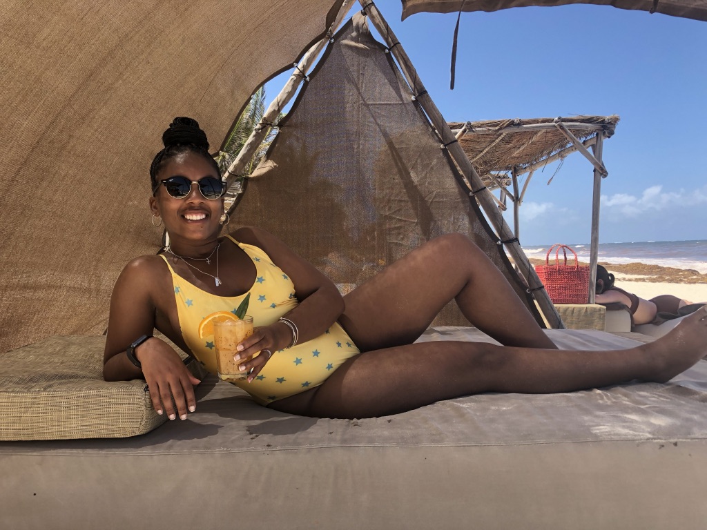 black girl in yellow swimsuit