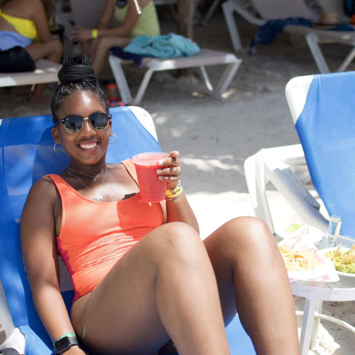 Caleta Tankah black girl in orange suit