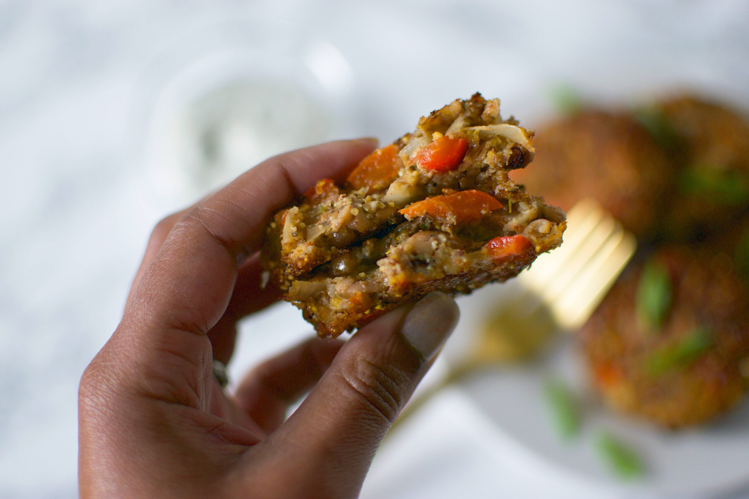 Hand holding Black-eyed pea fritters