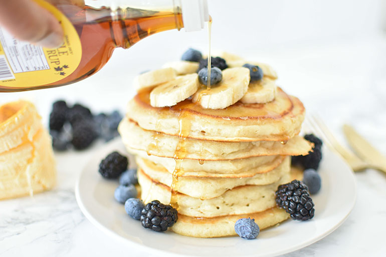 Fluffy Easy Vegan Pancakes stack with maple syrup drip