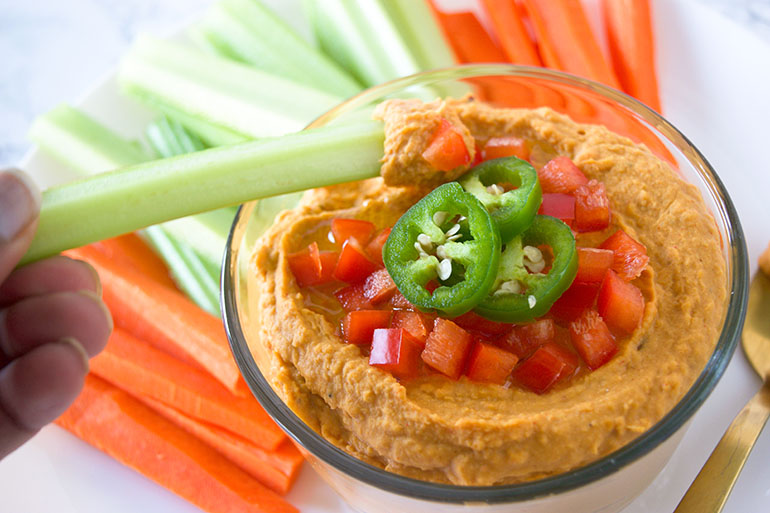 Buffalo Hummus Dip in a glass bowl