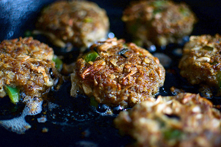 Vegan Jackfruit Crab Cakes in black pan