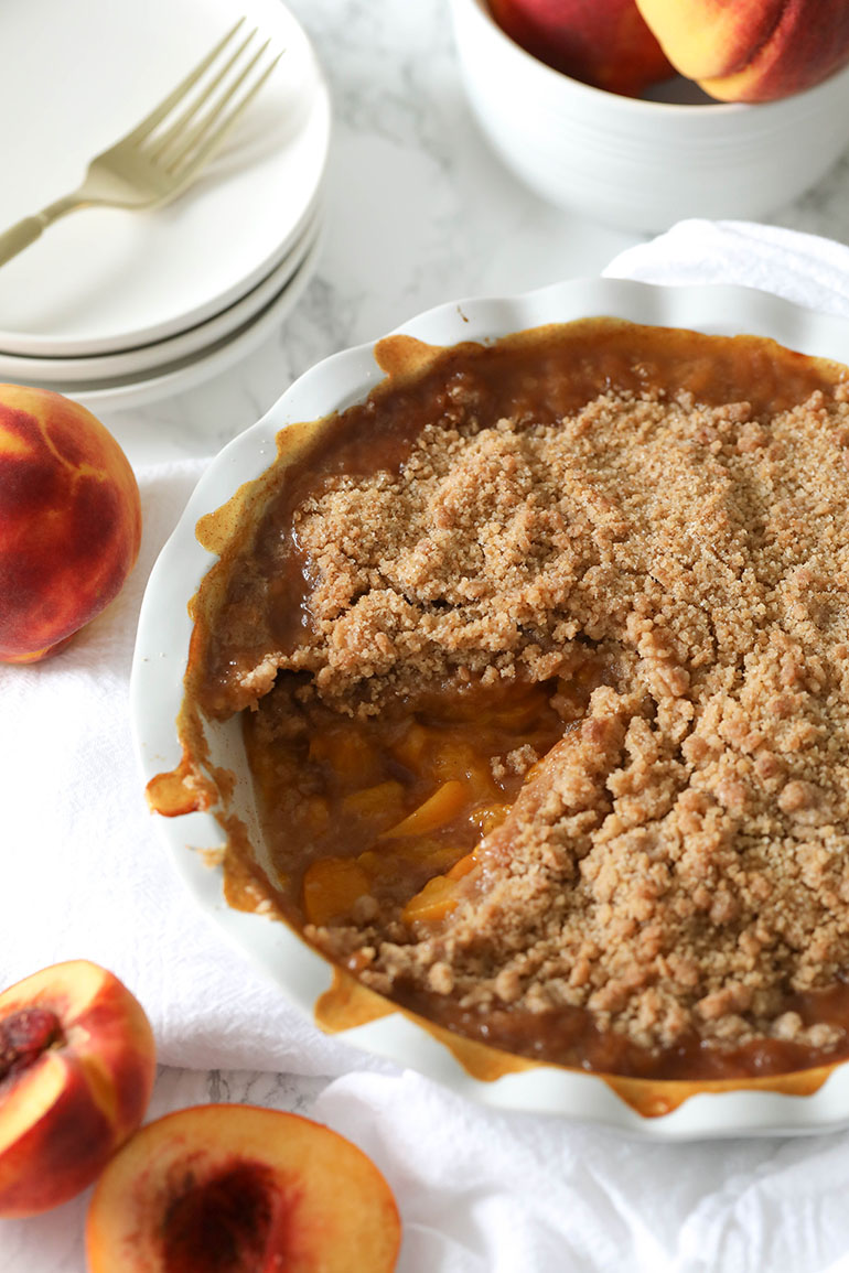 Vegan Peach Crisp in white dish