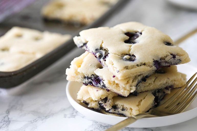 Vegan Blueberry Sheet Pan Pancakes stack with gold fork