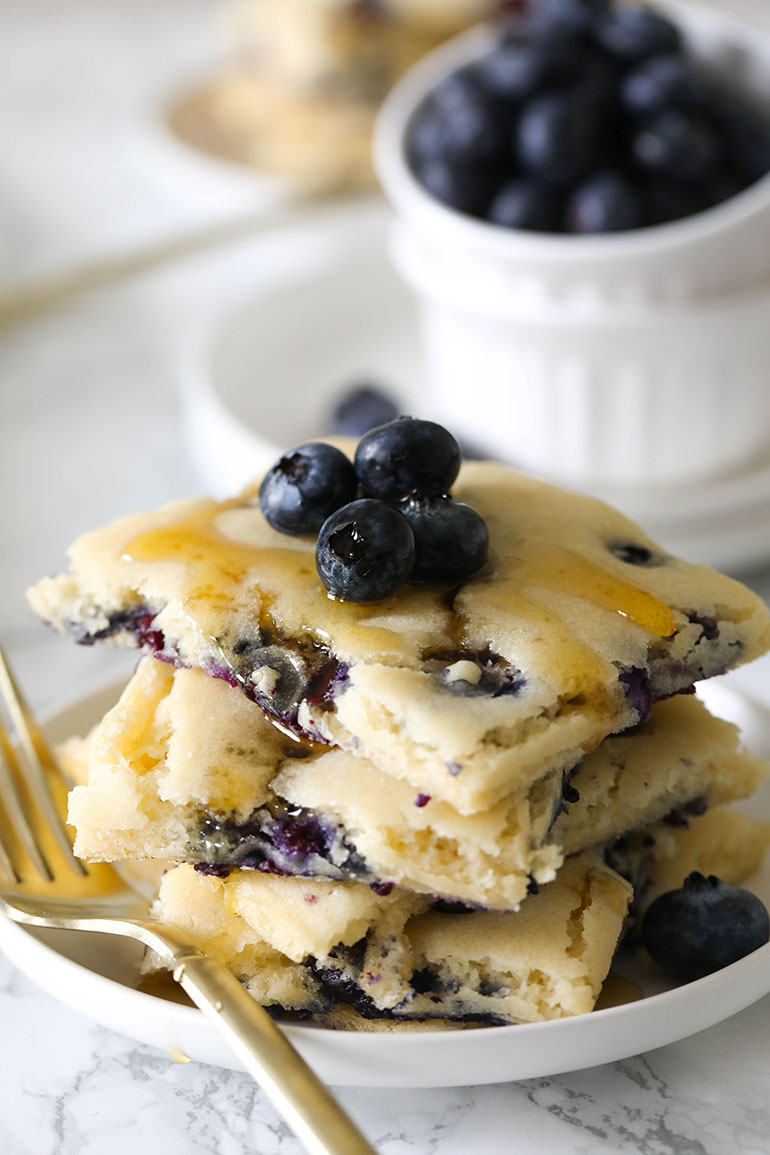 Vegan Blueberry Sheet Pan Pancakes with maple syrup drizzle