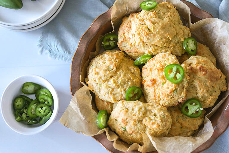 Vegan Jalapeño Cheddar Drop Biscuits in brown dish