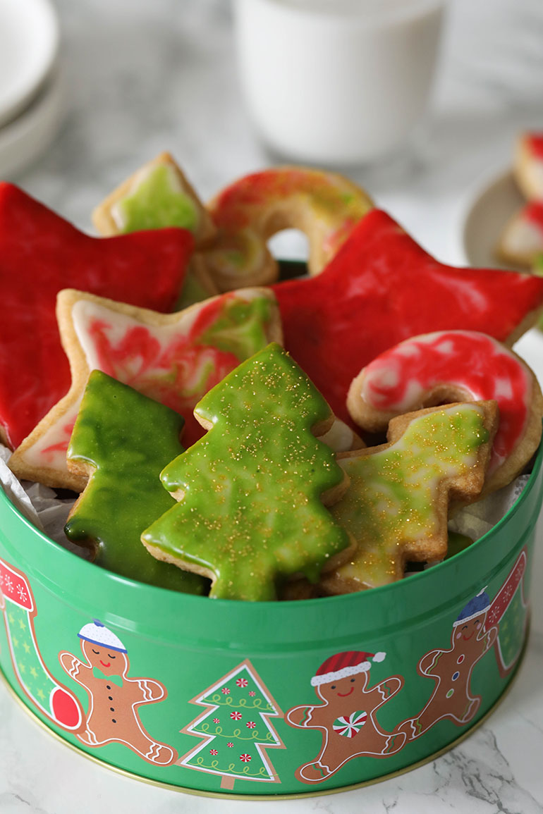Vegan Cutout Christmas Cookies in green tin