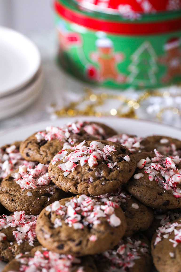 Vegan Peppermint Chocolate Chip Cookies with green tin in back