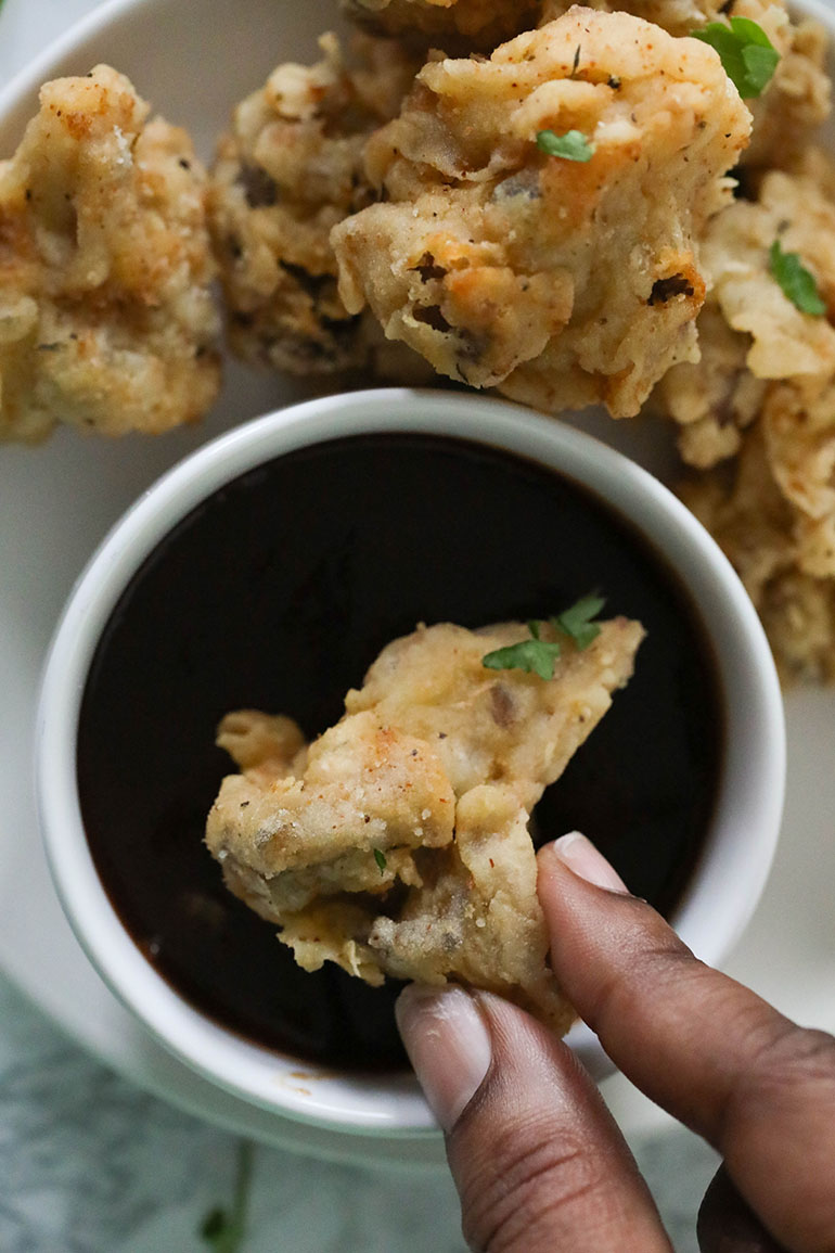 Fried Oyster Mushrooms with brown hand dipping