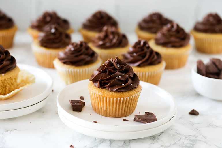 Group of Vegan Yellow Cupcakes with Chocolate Frosting