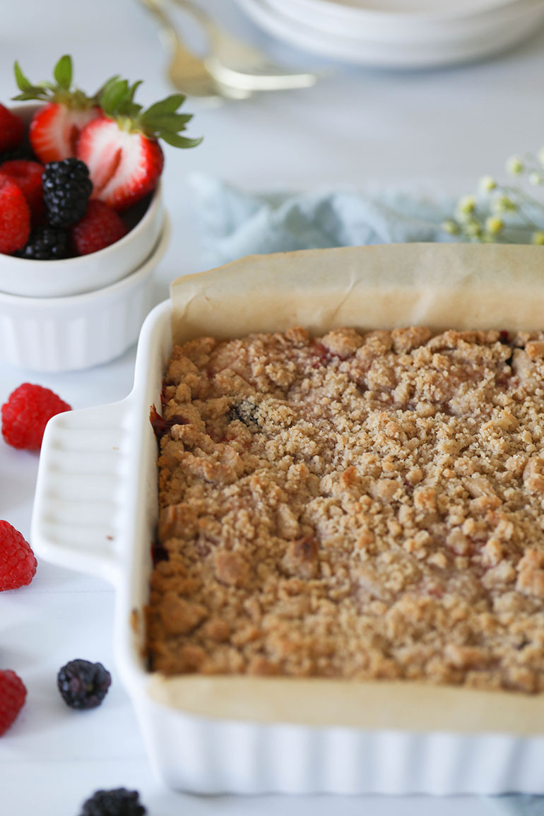 Easy Vegan Triple Berry Crumb Bars on the table