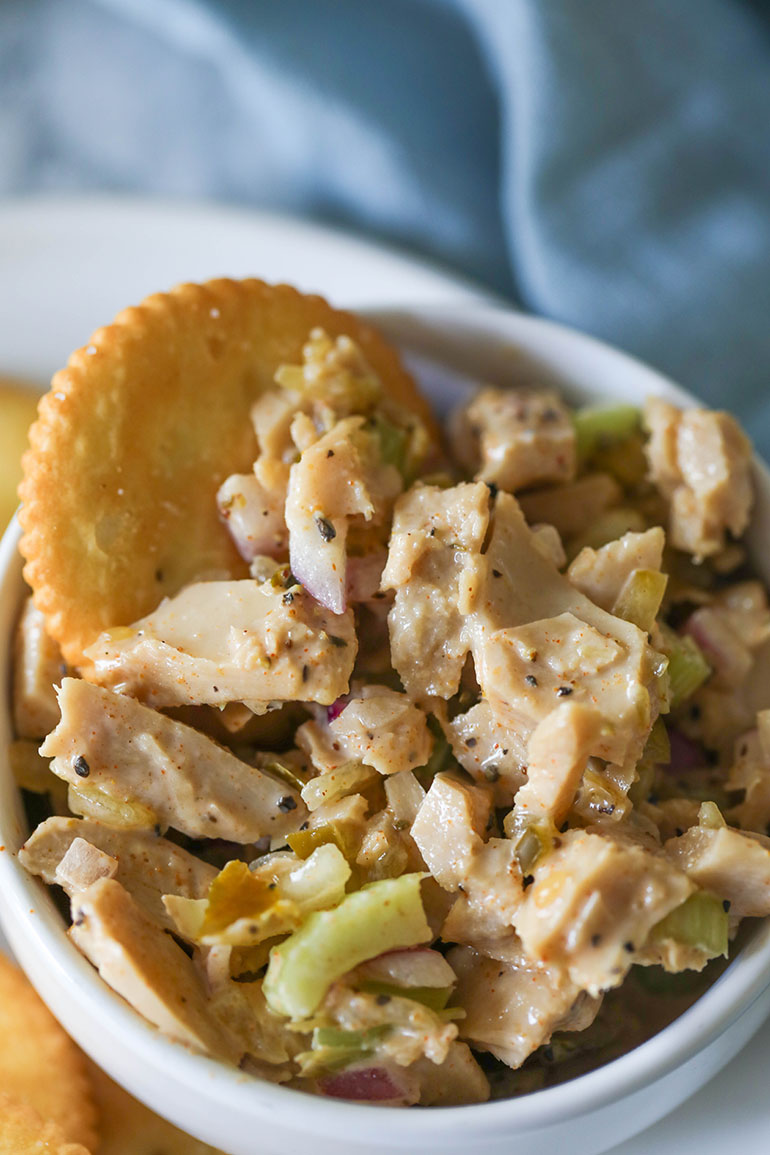 Vegan Chicken Salad with crackers on white plate