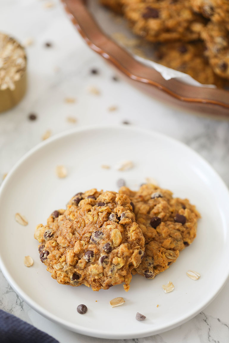 2 Vegan Pumpkin Chocolate Chip Oatmeal Cookies on white plate