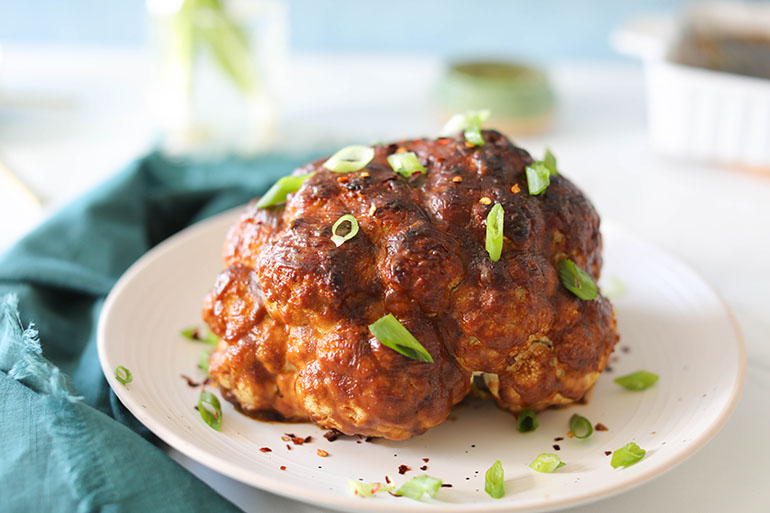 Spicy Roasted Cauliflower Head on white plate