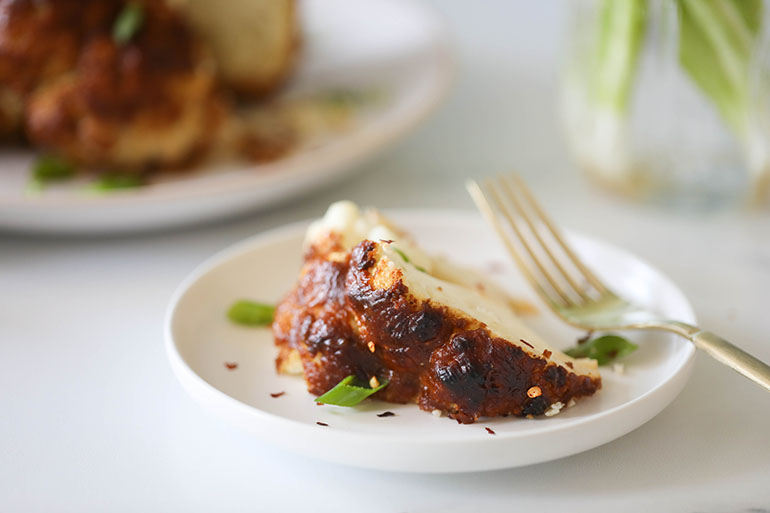 Spicy Roasted Cauliflower Head on white plate