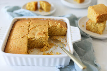 Easy Vegan Cornbread in white dish with gold knife